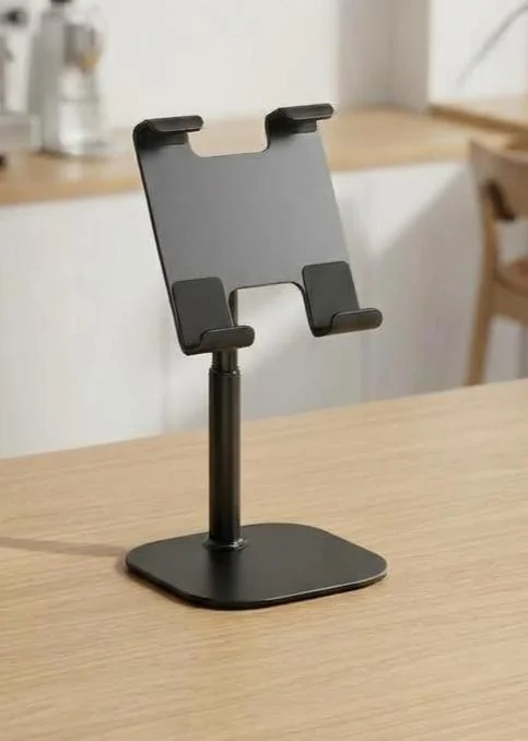 Height-adjustable black tablet stand on a desk